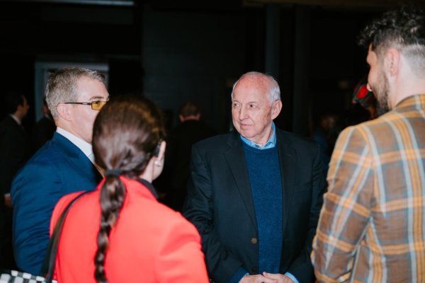 group of people smiling and talking