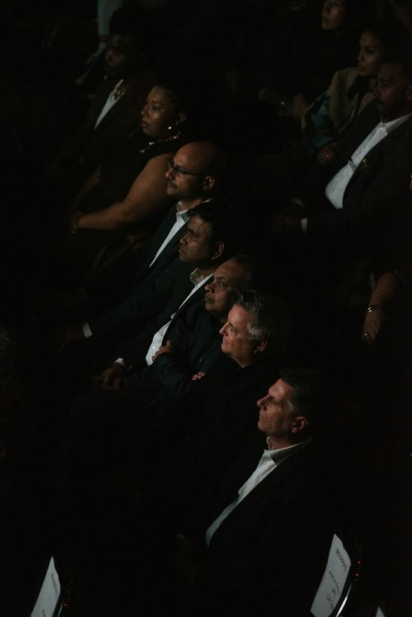 people sitting in theatre seats