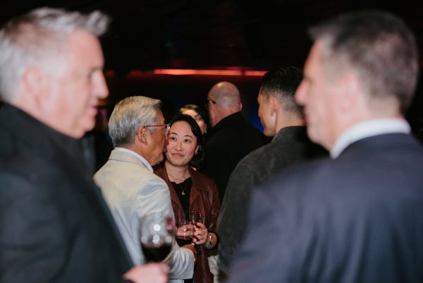 group of people smiling and talking