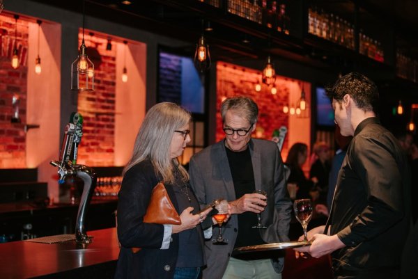 group of people smiling and talking