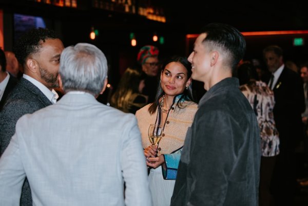 group of people smiling and talking