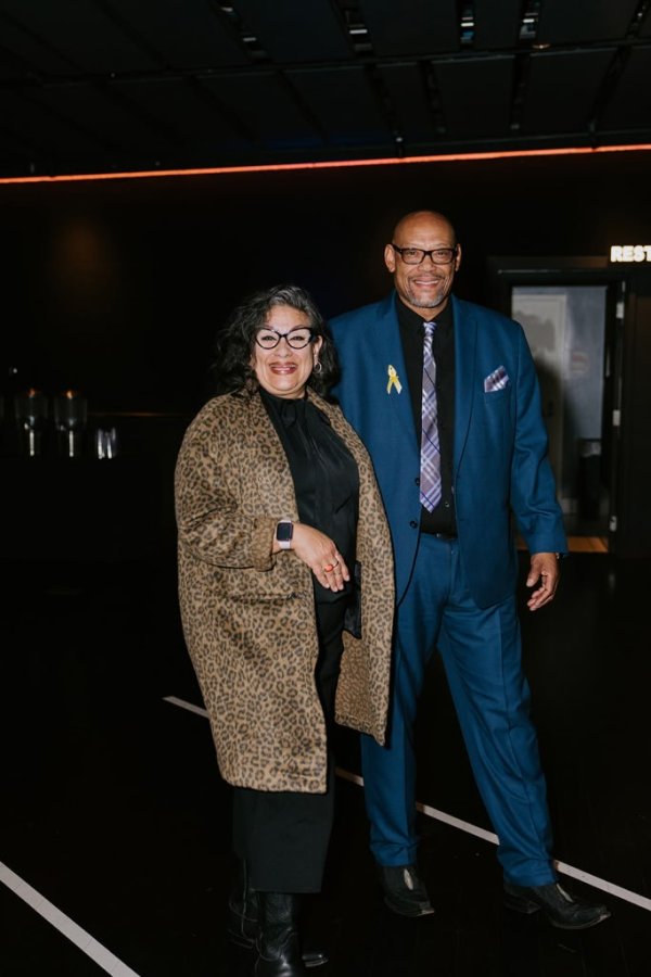 man and woman walking and smiling