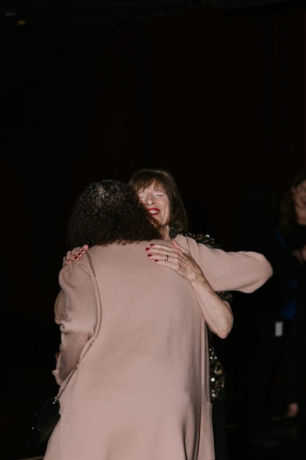 2 women embracing each other