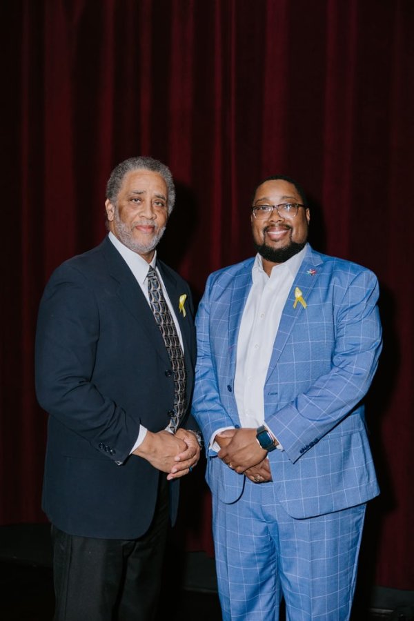 2 men smiling for a photo