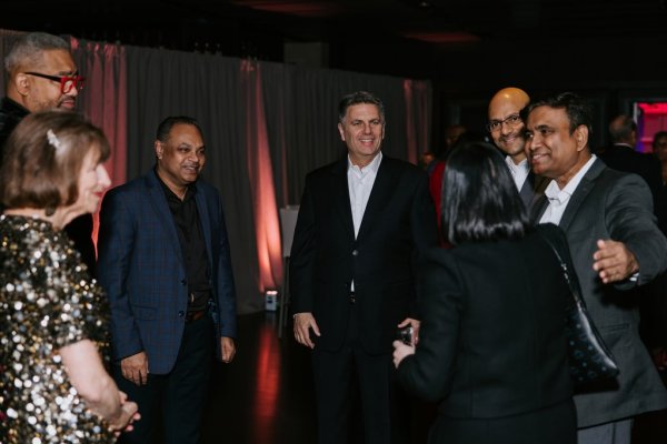 group of people standing and smiling