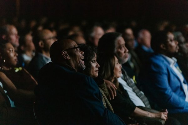 people watching a theatre screen