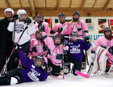 Young girls from the Power Project wearing hockey gear
