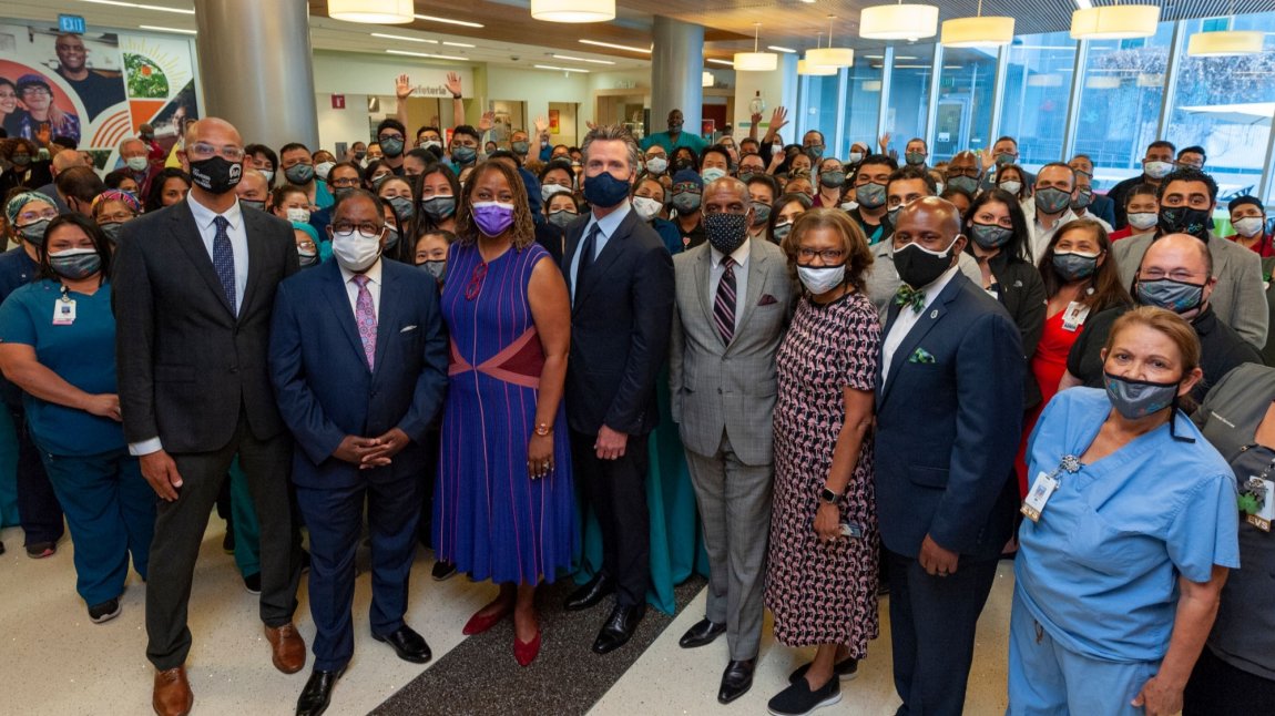 Photo of Gov. Newsom, elected officials, MLKCH CEO and staff