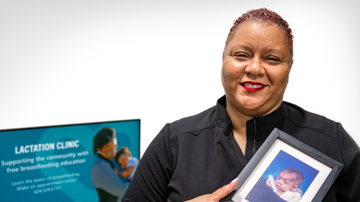 Lydia Boyd holding a photo of her baby