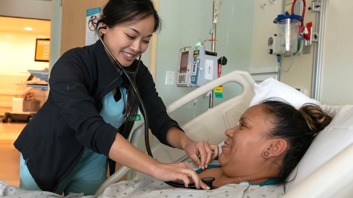 Female doctor treating a female patient