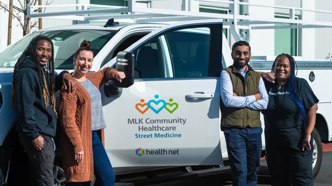 Staff standing in front of a Street Medicine truck