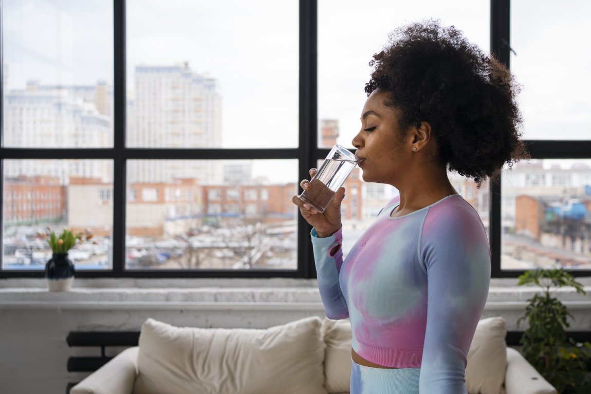 Woman drinking water.