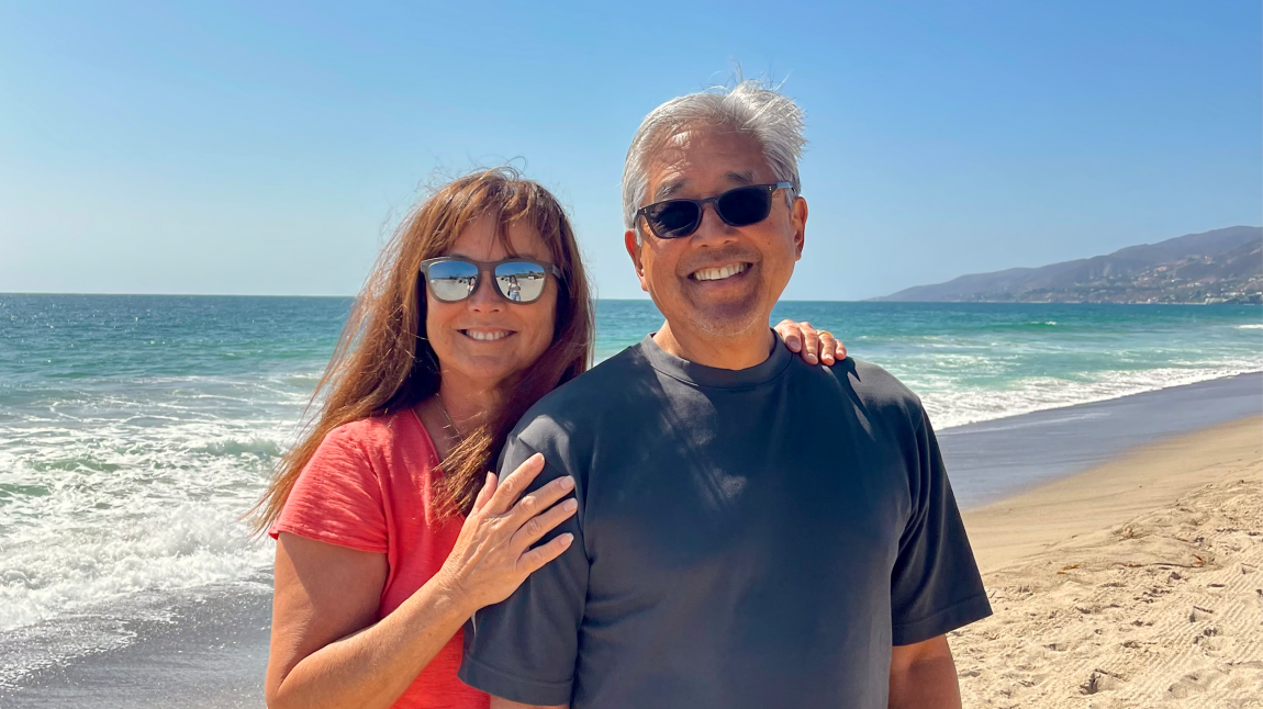 Man and woman smiling on the beach