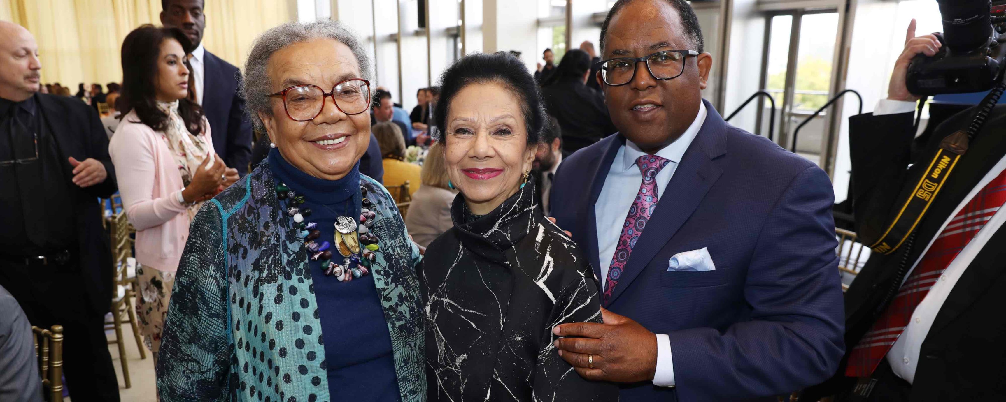 Marian Ray Edelman, an older Black woman, standing next to and Mark Ridley-Thomas, an older Black man