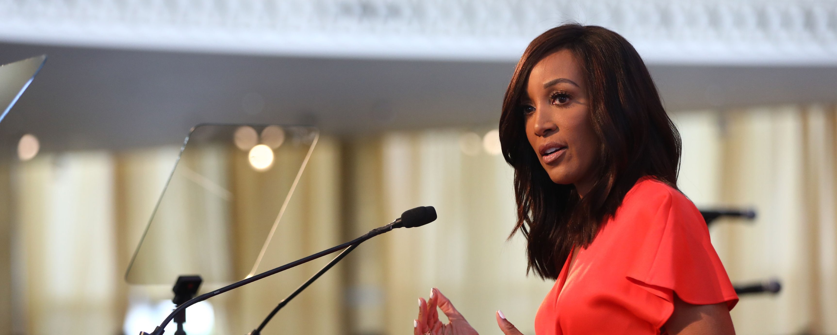 Close up of Shaun Robinson, a middle-aged Black woman, at the podium