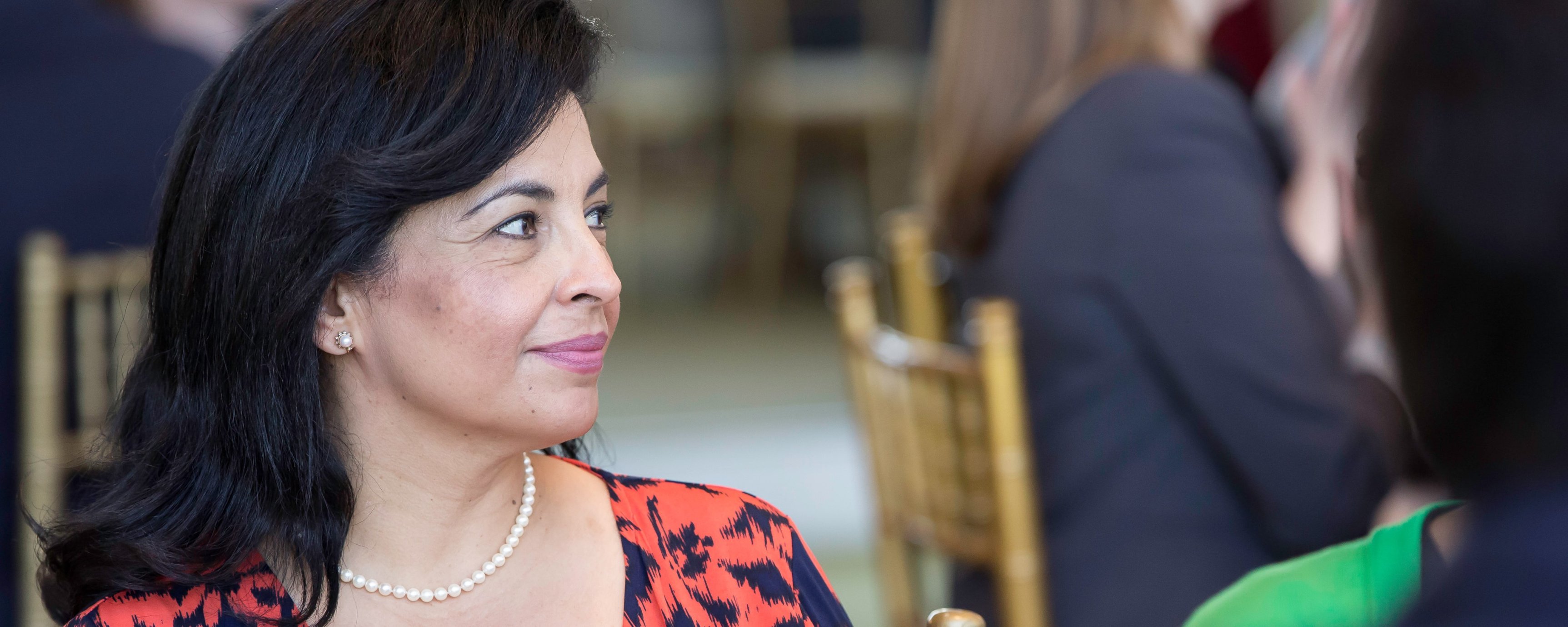 Close up of Latina woman seated at the event