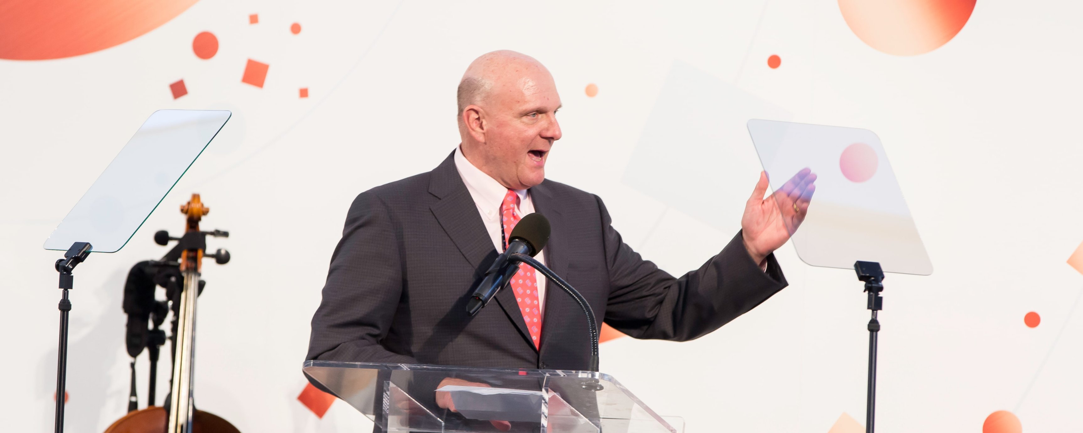 Steve Ballmer, an older white man, speaking at the podium at the Dream Lunch