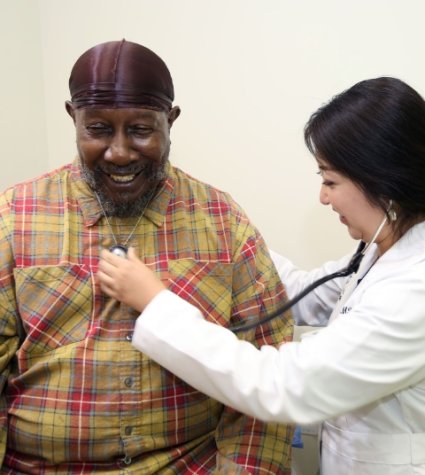 Photo of African American patient with Asian physician