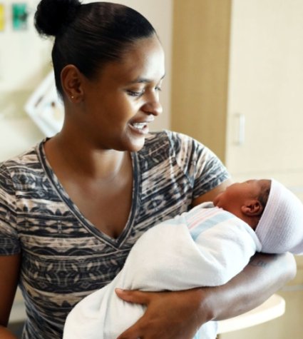 Photo of a black mom holding her baby