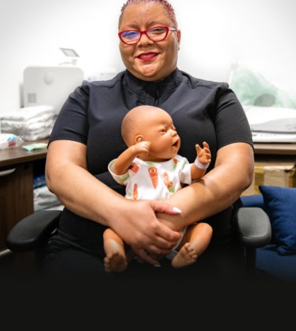 Lydia Boyd holding prop baby