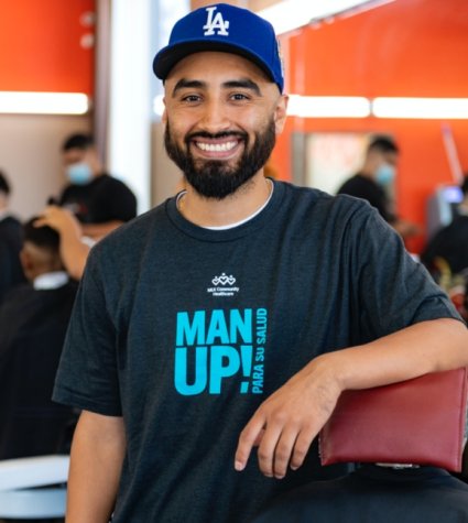 Photo of man with a cap in a barbershop