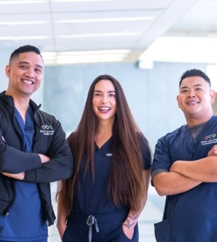 Photo of a group of three nurses: two male; one female