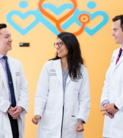 Photo of two male doctors and one female doctor