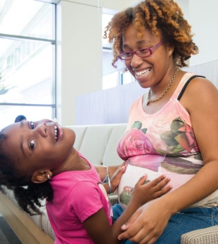 Photo of pregnant AA mom with daughter