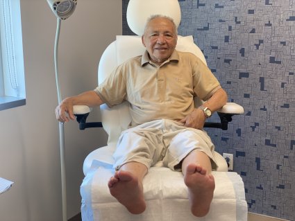 Wound care patient sitting in a chair.