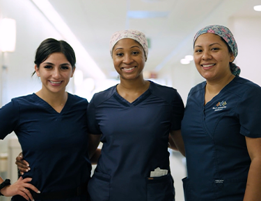 3 nurses smiling