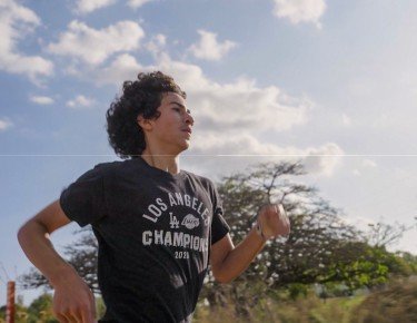image of young Latino boy running