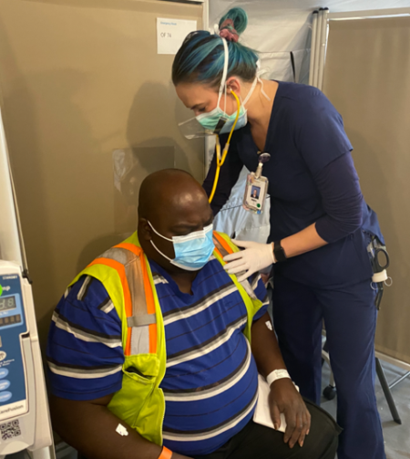 Nurse Danica Riedlinger treats a patient