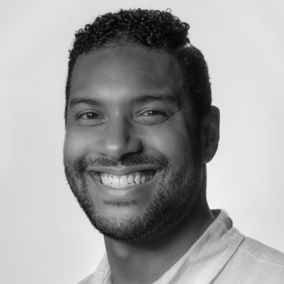 Young black man smiling at the camera