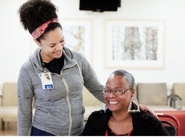 MLKCH nurse smiling with MLKCH patient