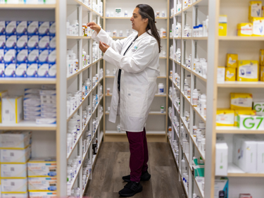 MLKCH pharmacist checking medication.