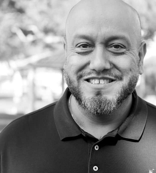 Portrait of middle aged bald Latino man with beard