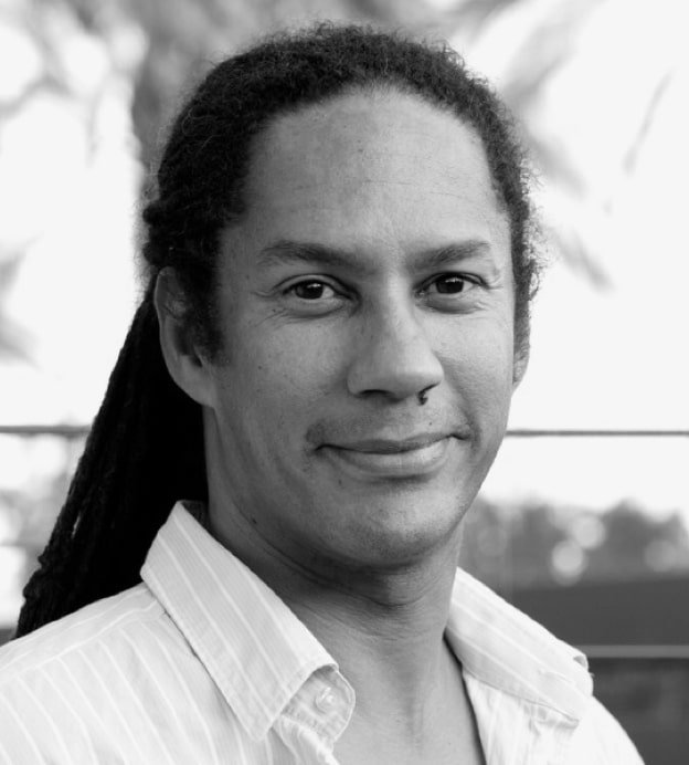 Black and white headshot of Chef Govind Armstrong, a middle-aged Afro-Caribbean man