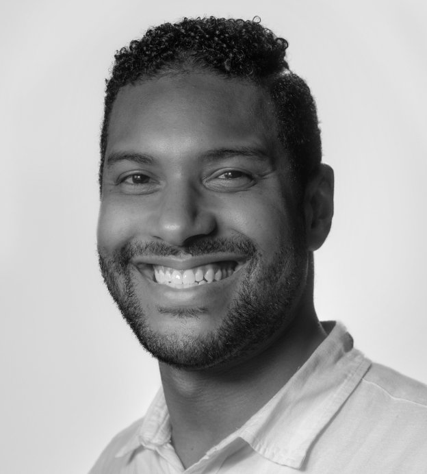 Image of young black man smiling at camera