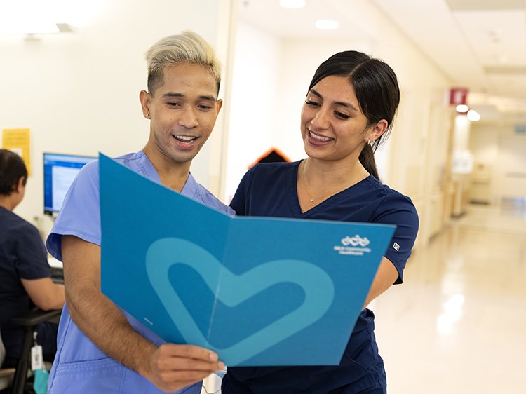 image of two nurses looking at documents