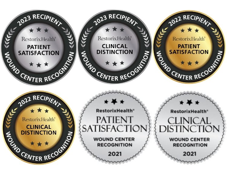 Photo of six Restorix badges 2020-2023