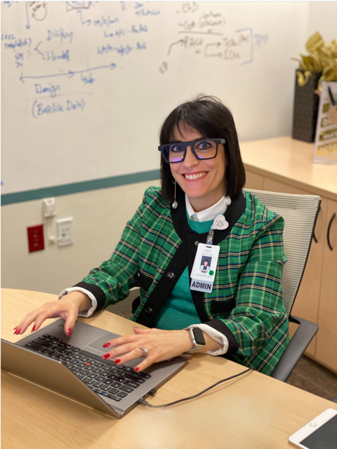 Woman smiling at her desk