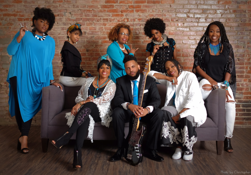 group of black men and women smiling together