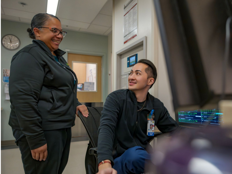2 care managers smiling at each other
